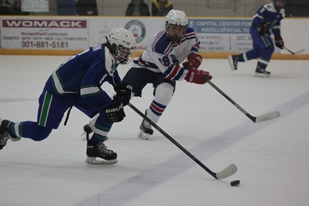 Junior Trevor Dixon (left) carries the puck down the ice to lead CHS to victory. 
