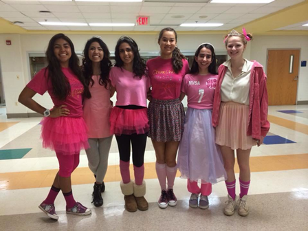The volleyball team dresses as fairies to support breast cancer awareness. 
