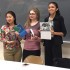 Clarksburg HS senior Dahlia Huh (left) and CHS seniors Sammi Silber and Elina Kapoor (center and right) display their books at Student Author Night.