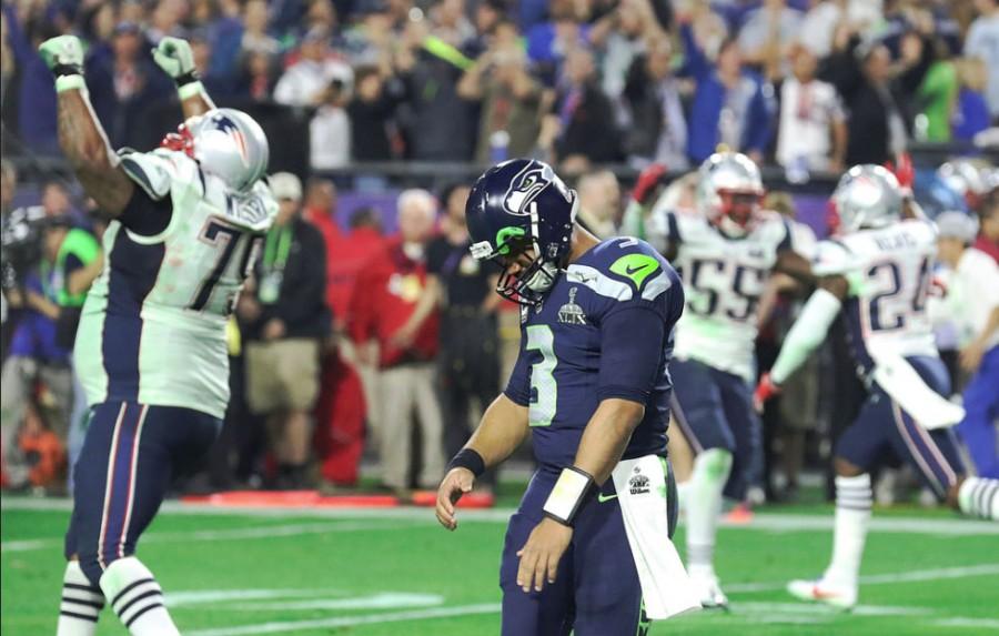 Seattle Seahawks quarterback Russell Wilson drops his head after throwing an interception on the Patriots one yard line. 