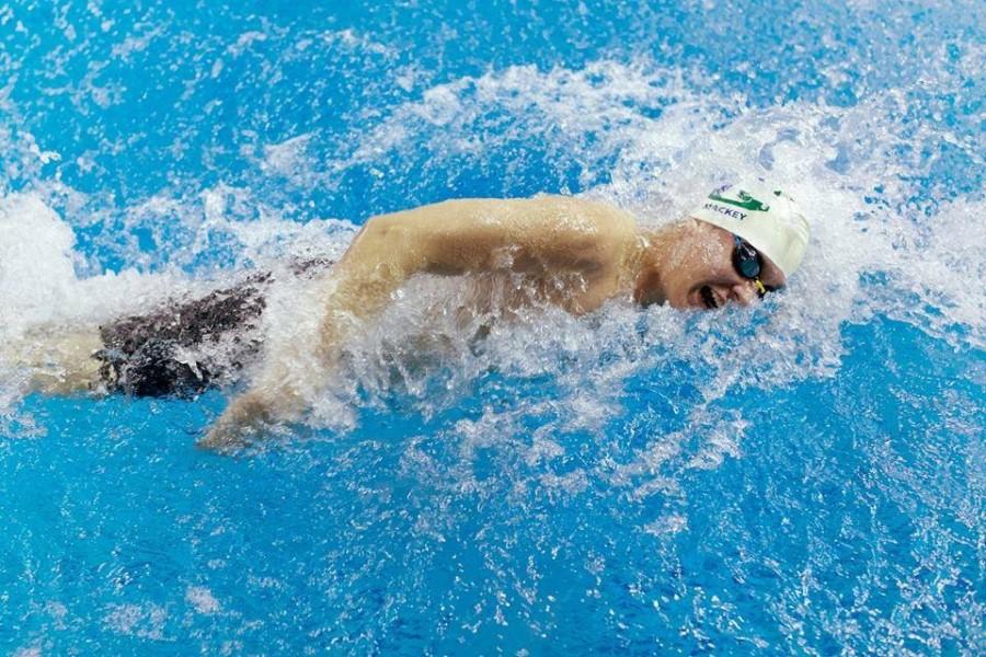 Senior Colin Mackey swims 50 m freestyle during Metros Feb. 7. 