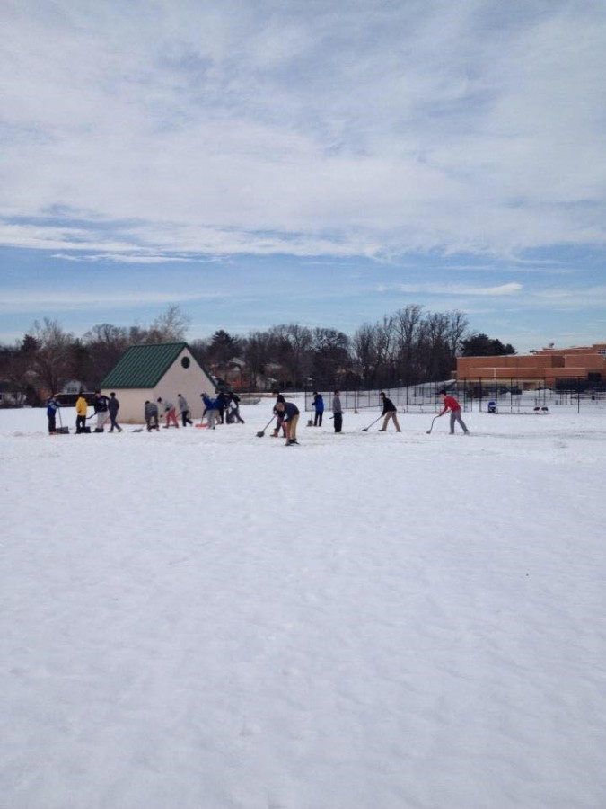 In preparation for tryouts Feb. 28, boys lacrosse players shoveled their practice field Feb. 25, only to have school closed the next day due to snow. 