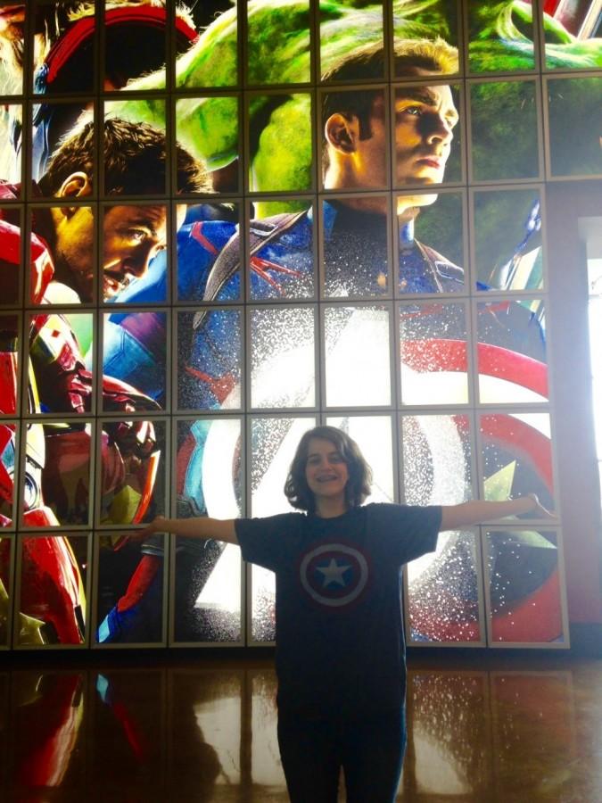 Senior Christina Hnatov in front of the Arclight display for Age of Ultron.