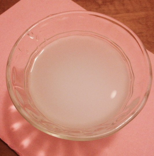 A bowl of rice water that can either be drank or used as a toner for the face.