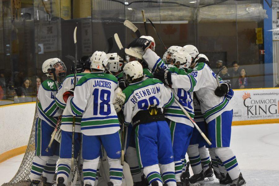The Bulldogs celebrate on the ice after defeating Wootton 3-2 Nov. 18.