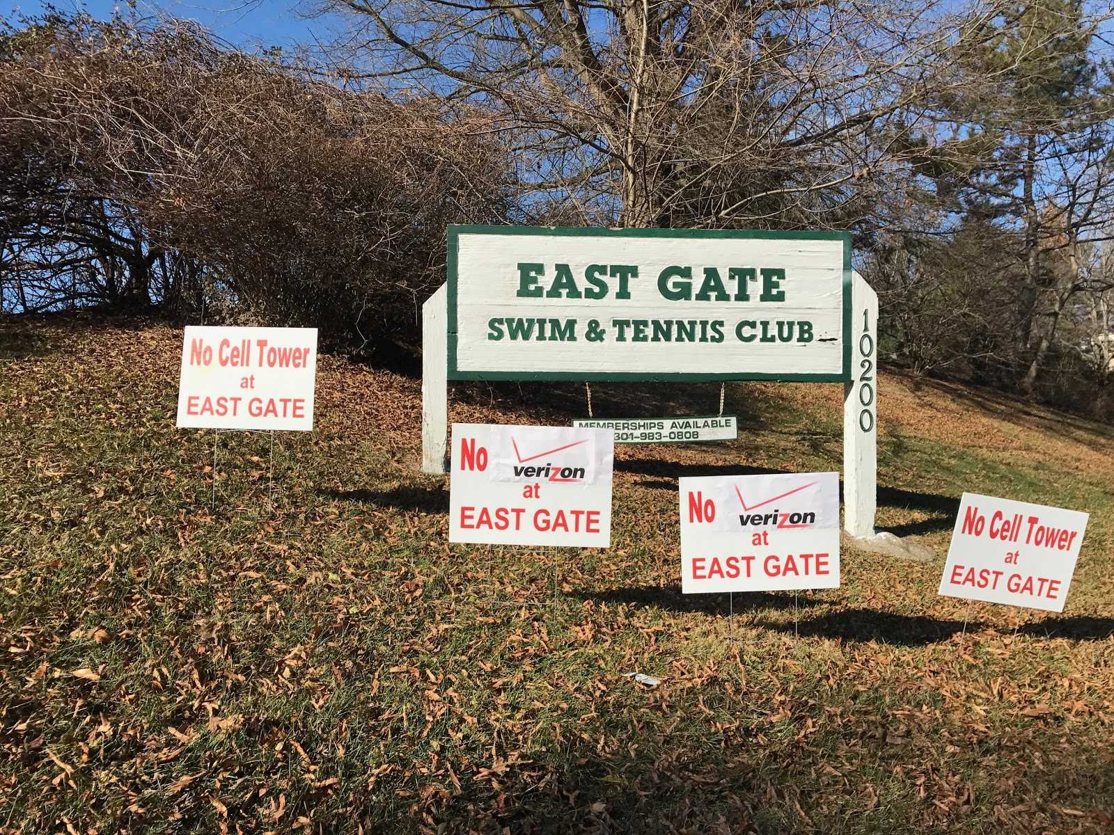 Signs have been put up at the East Gate Swim and Tennis Club in protest of the proposed Verizon Wireless cell phone tower.