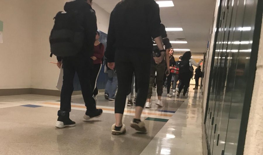 Students head through the hallways to make it to class before the bell rings. Administration is starting to crack down on tardiness.