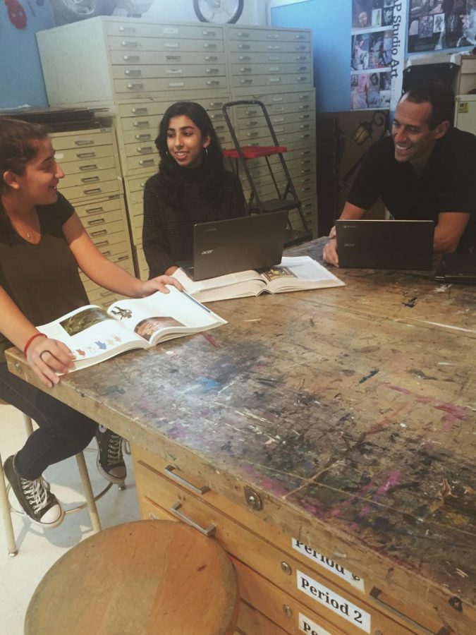 Juniors Nura Dhar and Leah Stein, along with art teacher Paul Dermont discuss plans to create a new arts course at CHS next year. The course will have lessons and Socratic-seminar type discussions.