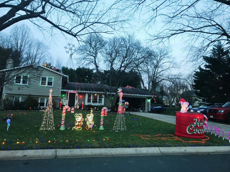 The Fenton family puts up lights and decorations on their lawn, roof and in front of their house to get into the holiday spirit.