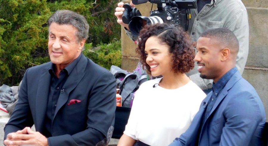 Michael B. Jordan, who plays Adonis Creed poses with fellow actors Tessa Thompson and Sylvester Stallone.