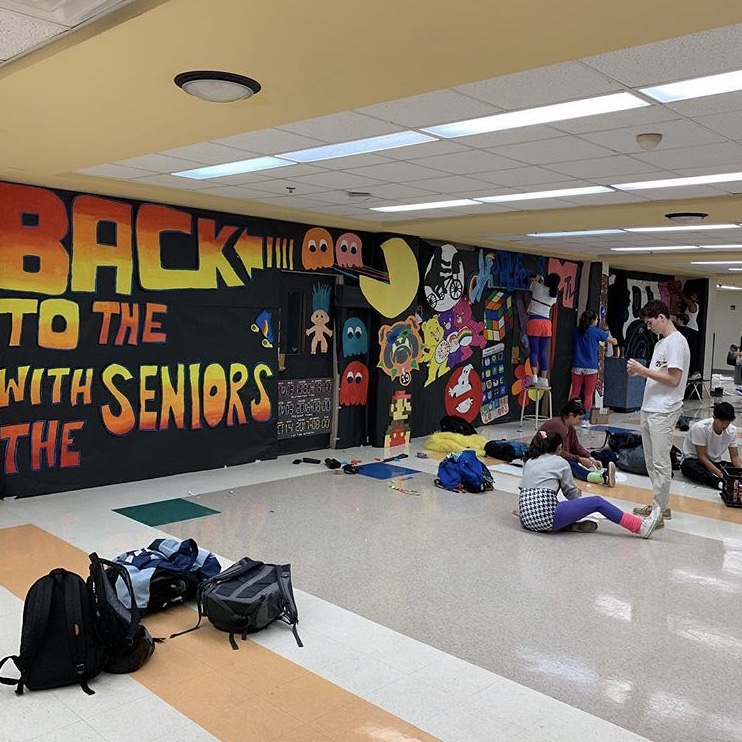 
The WCHS Senior class of 2019 works hard on their homecoming mural with their “back to the past” theme. 
