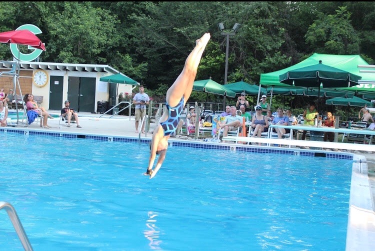 Sophomore Sydney Norris practices her dives at her practice during the summer. Norris dives year round and does not have breaks between seasons, allowing for more developed skills. 