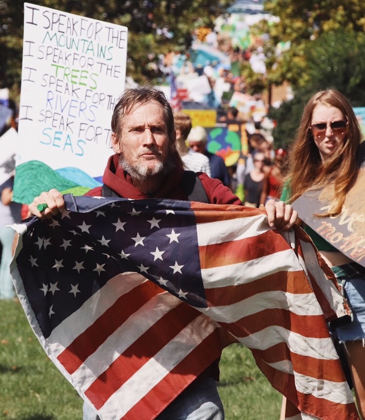 
WCHS senior Hannah Roberts attends protests and uses her photography skills as her voice. This photo was taken in D.C. during the Climate Strike as Robert captures activists protesting regarding climate change. 
