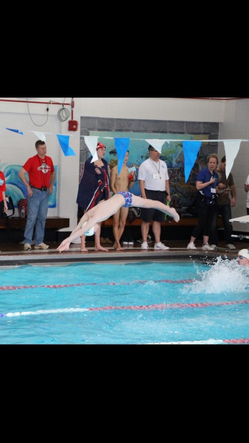 Junior Cameron Barclay exhibiting his athletic skill with a graceful swan dive to start the race.