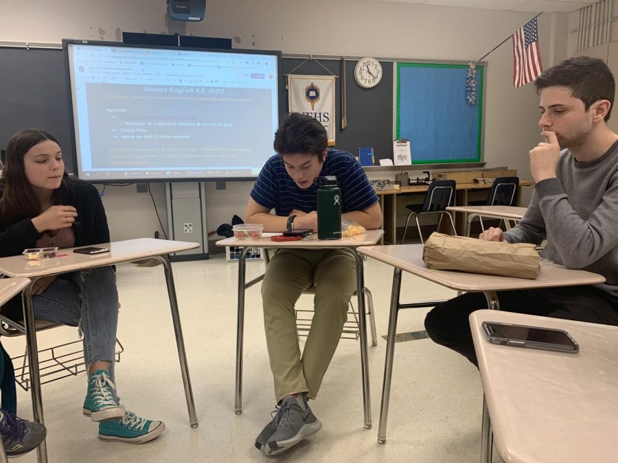 Senior Mary Hinton (left) and Junior Trevor Gardemal (right) join EHS student board member Jonathan Silverman (middle) to discuss Ray Bradbury’s short story “There Will Come Soft Rains” on Nov. 21st. These book club meetings occur around once a month and members can request which books to read and discuss.