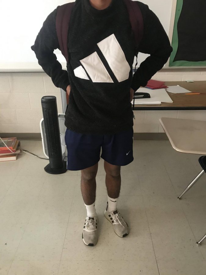 
Junior Jet Raaj wears a sweatshirt and shorts during the freezing months of Decmeber in order to not overheat during the school day.
