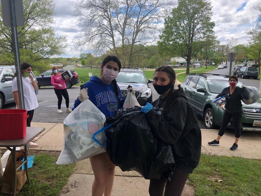 RMHS+sophomore+Christina+DeFiore+%28left%29+is+joined+by+other+RMHS+students%2C+helping+the+DMV+community+by+volunteering+with+the+Covid+Cadets.+The+Covid+Cadets+collect+donations+from+doorsteps+and+front+porches%2C+taking+them+to+So+What+Else%2C+an+organization+that+donates+toys%2C+games%2C+clothes+and+many+more+to+low-income+families+in+the+area.