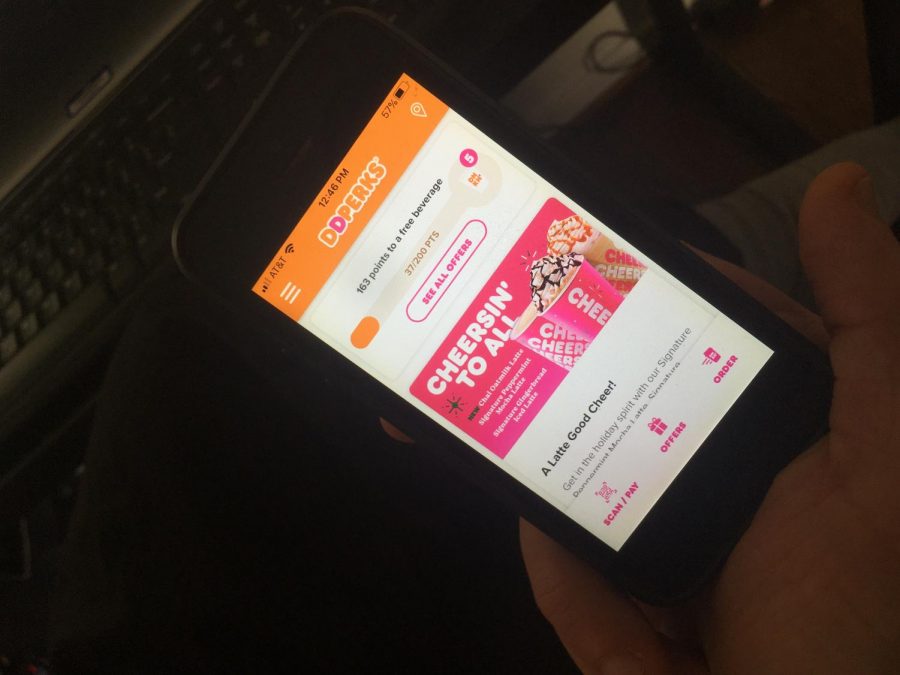A WCHS student uses the Dunkin' Donuts app to order food pickup. The Dunkin' Donuts app allows students to order food safely during the pandemic.
