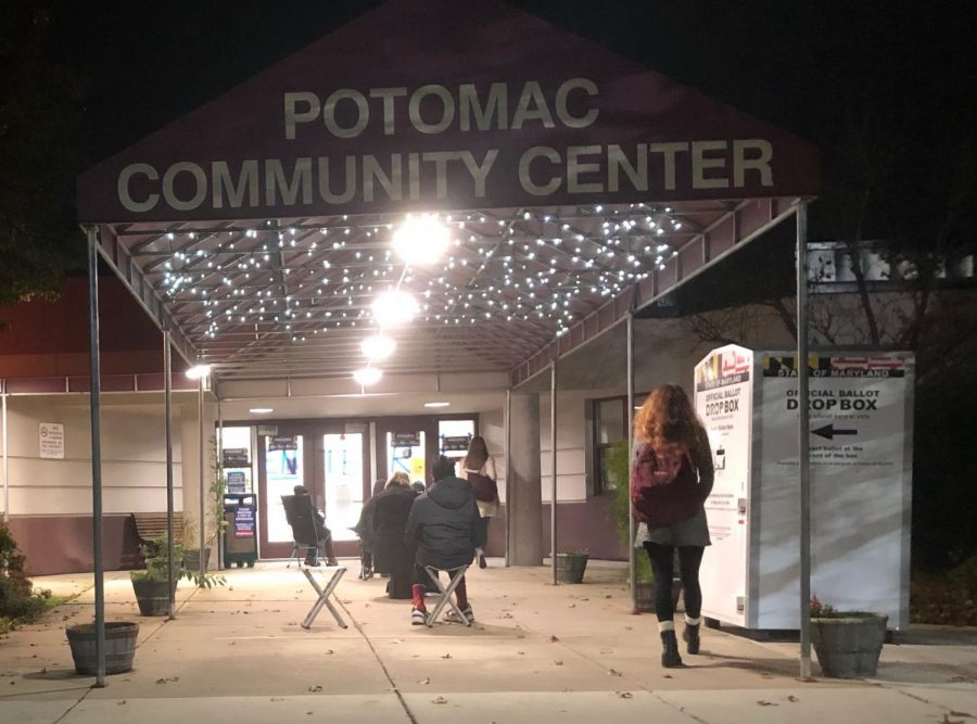 Junior Bridget Kelly (right) walks into the Potomac Community Center on Oct. 28 for her assignment as a poll worker. Kellys shift runs from 6 am until 11 pm and consists of setting up the precinct, checking voters in and helping them vote. 