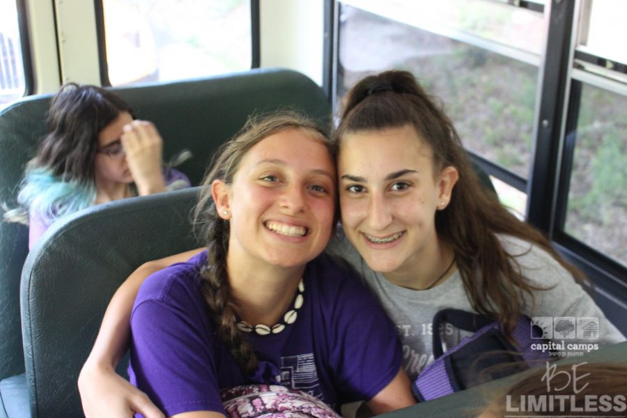 Tova Niles sits on the bus with a friend on the way to sleep away camp. She had attended for five summers in a row before it being cancelled last year.