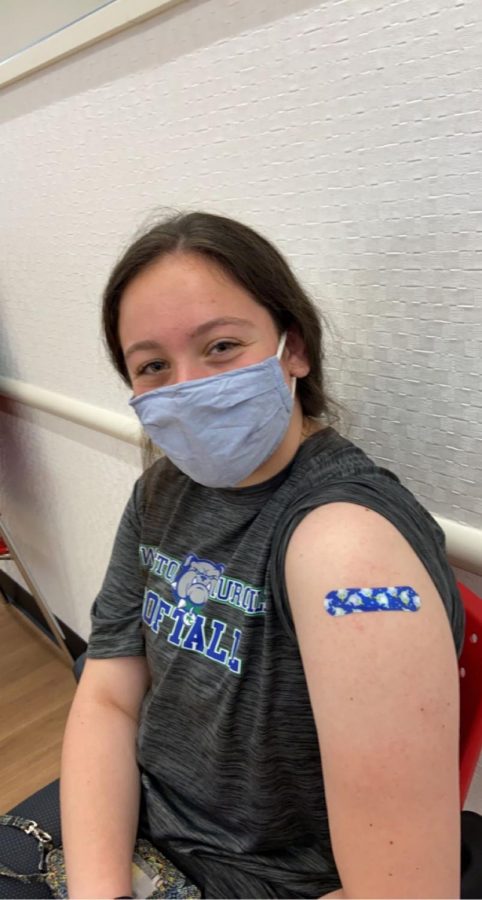 WCHS junior Dani Primerano smiles behind here mask after recieving her COVID-19 vaccine. Getting a cool narwhal bandaid was an added perk to finally getting the shot.