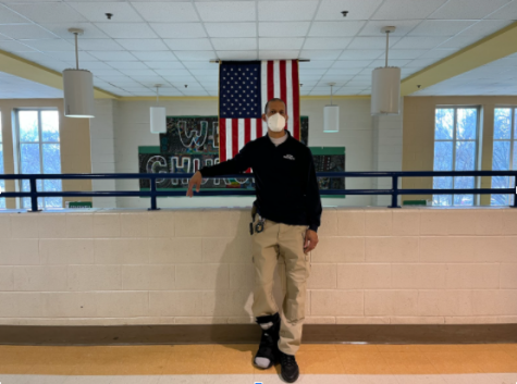 Terry Bell, WCHS security team leader, stands in front of the Bulldog lobby on February 10, 2022, as he watches over movement in the hallway. Security is extremely important, especially after everything that has happened recently.