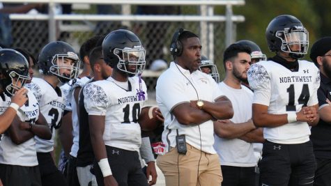Travis Hawkins, the head coach at Northwest, pictured standing on the sidelines during a football game. Since the fight on Sept. 16, his job has been vacated. 