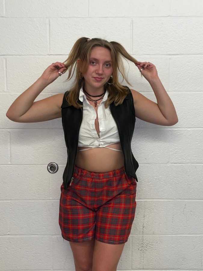 Aliyah+Primich+incorporates+many+of+her+clothing+pieces+that+she+made+into+her+everyday+outfits.+This+outfit+features+the+red+plaid+shorts+she+sewed+earlier+in+2022.++