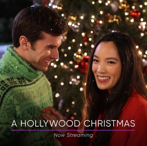 Christopher gazes at Jessica in front of a Christmas tree for the movie poster of A Hollywood Christmas.