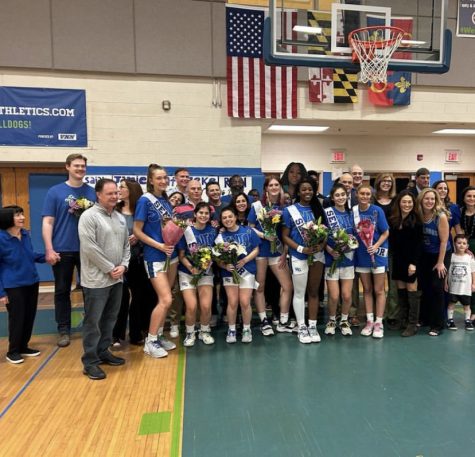The WCHS girls basketball team poses for the their senior night photo. Despite a successful season, the difference in attendance is shocking.