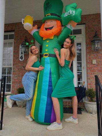 Kaki Hubeny and Julia Aksentijevich pose in front of an inflatable leprechaun for their Saint Patrick’s Day celebration last year. 
