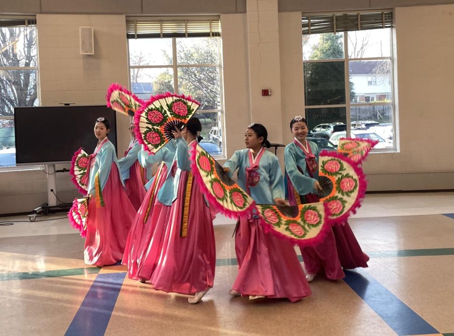 Hannah Choi and her dance group perform a Korean fan dance in the WCHS cafeteria at International Night on March 23. 