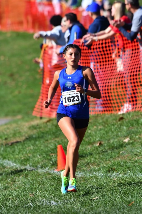 WCHS junior Hallie Muniez running the 5k at cross country states where she  placed 15th.
