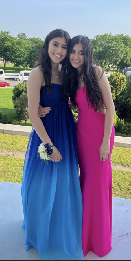 Former+WCHS+student+Reva+Mannan+poses+for+the+camera+during+her+prom+of+May+2022.+She+picked+an+ombre+style+dress+to+be+trendy+but+also+wear+something+she+loves.