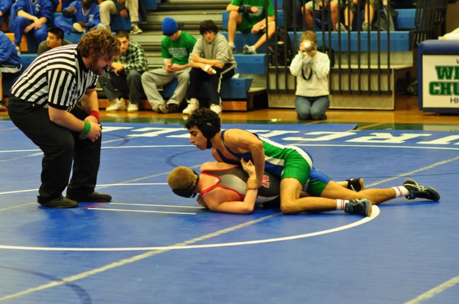 Junior Rustin Tashayyod grapples with a Northwood opponent Dec. 7.