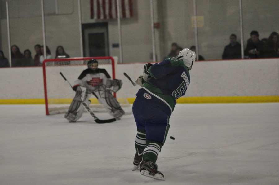 Senior Alex Dourian shoots on goal against Sherwood Feb. 3. The Bulldogs blew out the warriors 12-0 and remained perfect on the season.