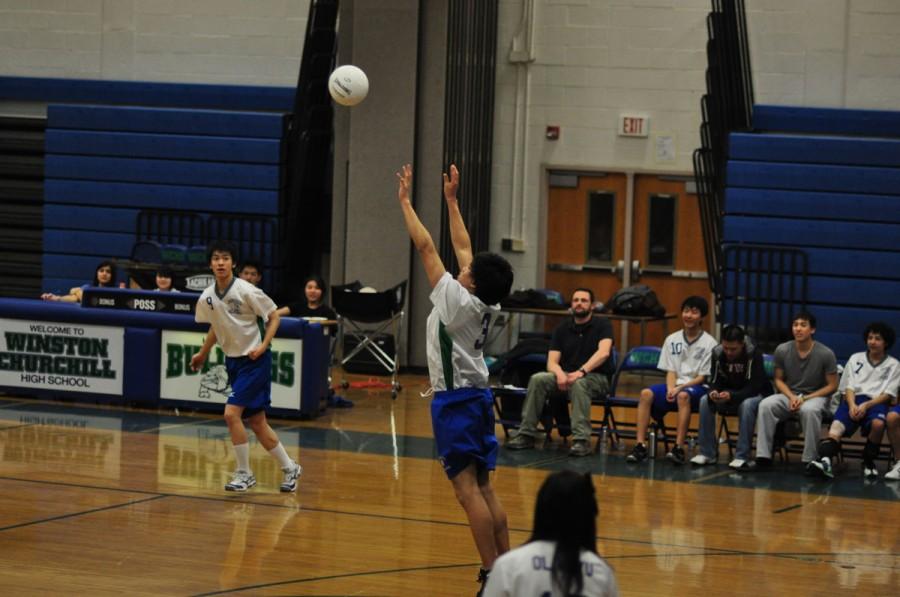 Junior Chris Woo sets the ball in a scrimmage. The boys team has found itself with a considerably younger roster than last season.