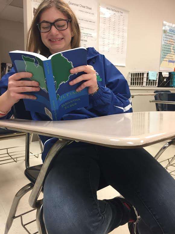 Sammi Silber holding her book.