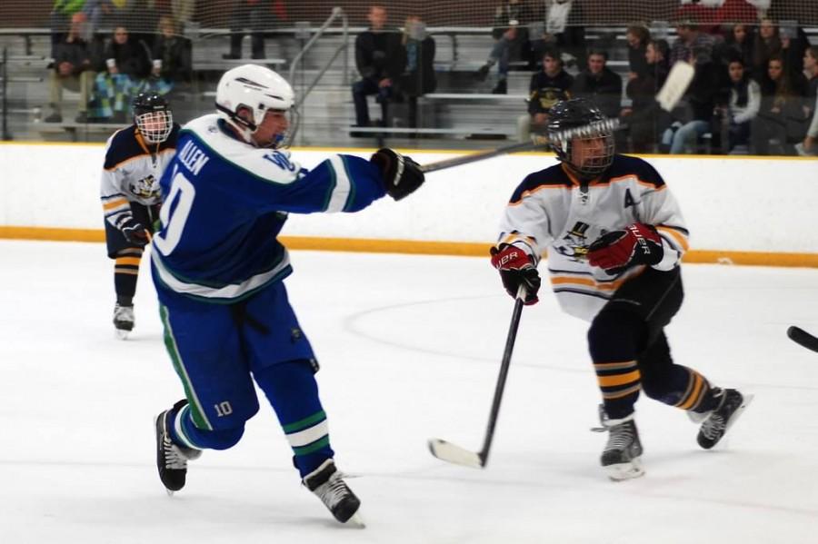 Senior and varsity-one captain Ross Allen shoots for the net during a match up against BCC.