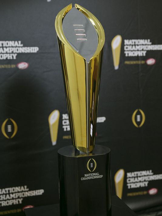 The+new+college+football+playoff+consists+of+the+top+4+teams+in+the+country+playing+for+the+newly+designed+championship+trophy.+