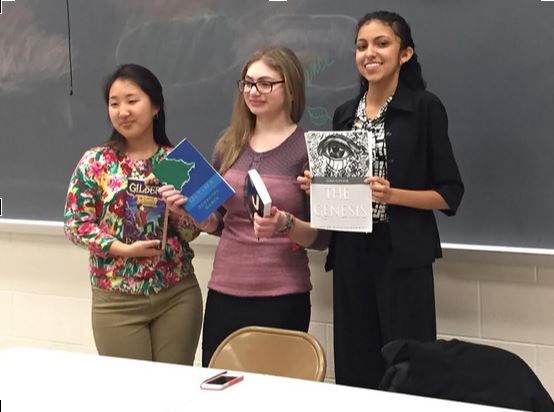 Clarksburg HS senior Dahlia Huh (left) and CHS seniors Sammi Silber and Elina Kapoor (center and right) display their books at Student Author Night.