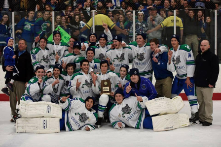 The Varsity One hockey team surrounds the State Championship trophy after beating Mariotts Ridge 10-0. 