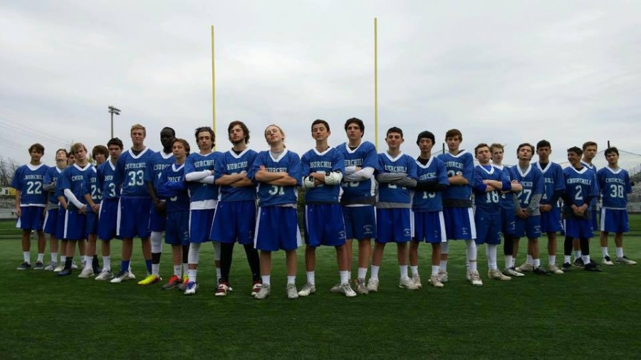 The JV boys lacrosse team poses for a picture after finishing their season 9-0