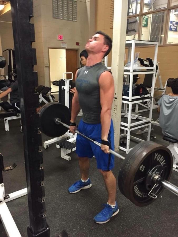 Health and Fitness Club President and founder Elliott Sloate demonstrates proper lifting technique.