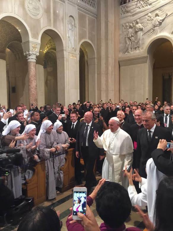 The Pope greets the adoring crowd at his reception. 