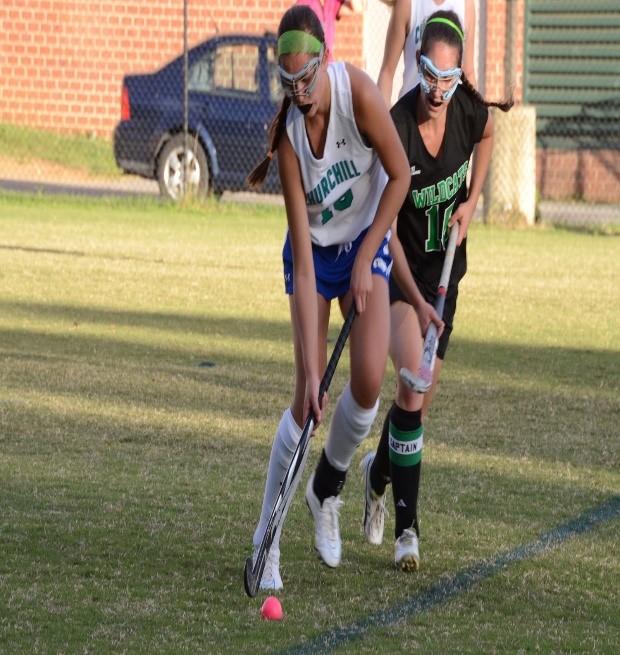 Sophomore Faith Kean navigates the ball around an opponent during a game against WJ