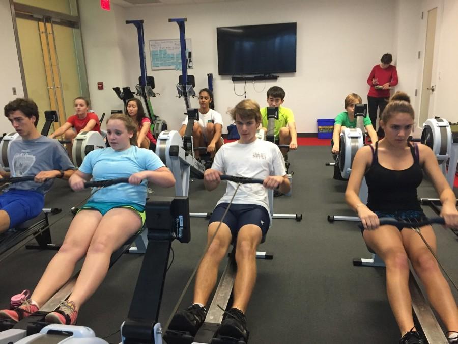 Members of the crew team workout in Erg machines to prepare for their spring season, which consists of shorter, 1.4 mile races.