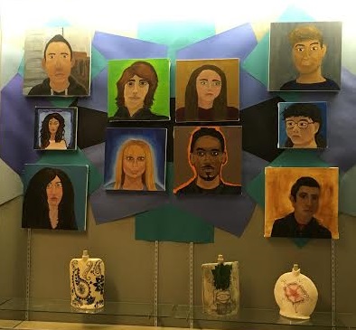 Studio One art students display their talent for portraits outside the art rooms.