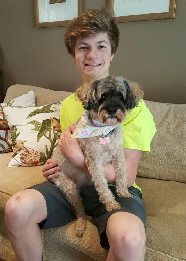 Freshman Charlie Butchko’s half- Schnauzer, half-poodle, Trixie, makes him smile after a long day. 