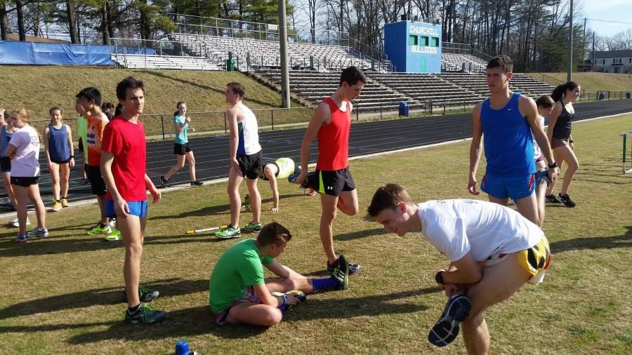 Second from left, senior Mitch Welter, junior Matthew Goldsmith and seniors Michael Hughes and Josh Frielich run as part of the Wolfpack. The close-knit group of distance runners have excelled as a group.